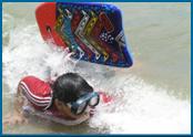 Charlie Hanika having fun in the surf